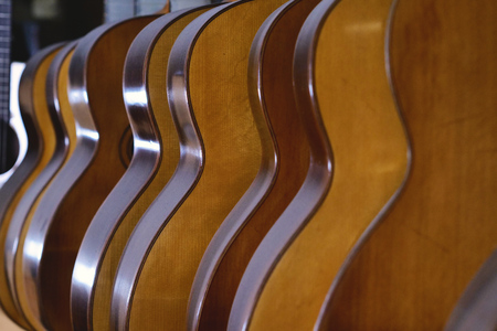 Close-up of a guitar maker, in which you can see pieces of guitars to be assembled. Concept of: music, tradition, ancient crafts.の写真素材