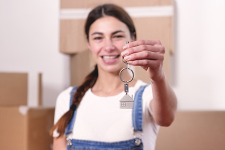 The keychain in the shape of a house. Concept of: future, new home, mortgage