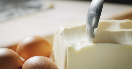 A chef prepares curls of butter, sweets, chef.