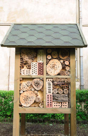 insect hotel created from natural materials in gardenの写真素材