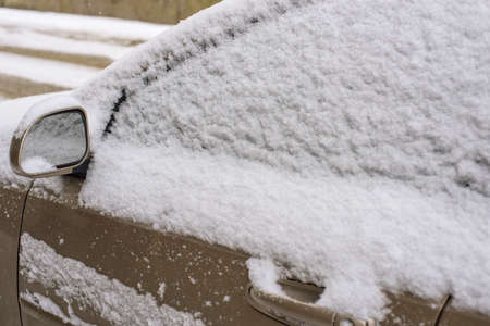 car door in snow during storm winter weatherの写真素材