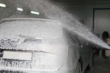 car wash process with washing foamの写真素材