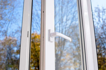 open plastic vinyl window on a background blue skyの写真素材