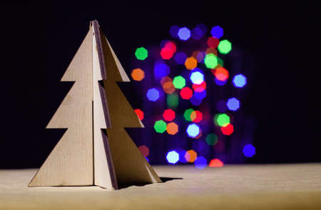 Christmas toy tree on colorful bokeh blur light backgroundの写真素材