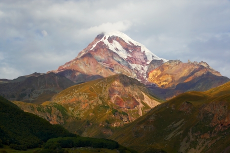 Landscape with the snow-covered high mountainの写真素材