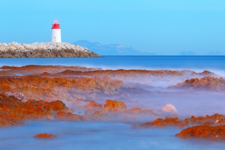 Beacon at the sea at sunsetの写真素材
