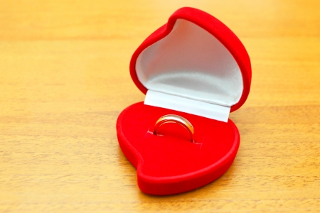 Wedding ring in a cover in the form of heartの写真素材
