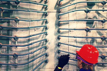 The worker in a helmet at plant.の写真素材