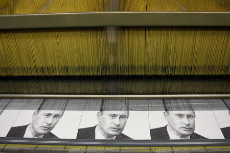 Vyritsa, Leningrad region, Russia-14 of February, 2012:Portret V. Putin on the weaving loom in Vyritsa, the Leningrad region, Russia, February 14,2012. Factory of portraits of the Russian politicians.のeditorial素材