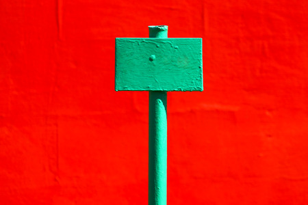 The plate against a red wall. Industrial abstraction.の写真素材