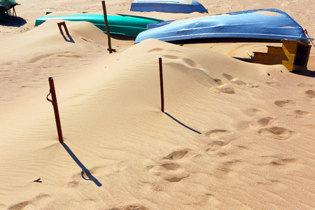 Sand dunes and boats on the ocean.Desert.Tunisia.の写真素材
