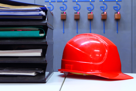 Business planning.Industrial background.Office.Helmet and papersの写真素材