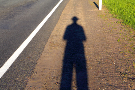 Self-portrait.The shadow man on the road.の写真素材
