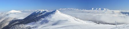 Cloud inversion and the snowy mountain peaks