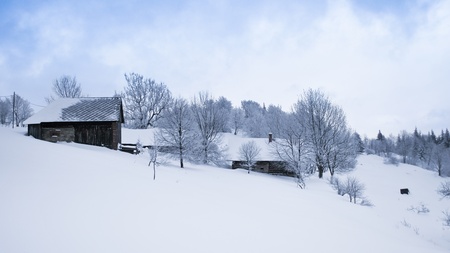 Winter in scenic mountain village covered with snow