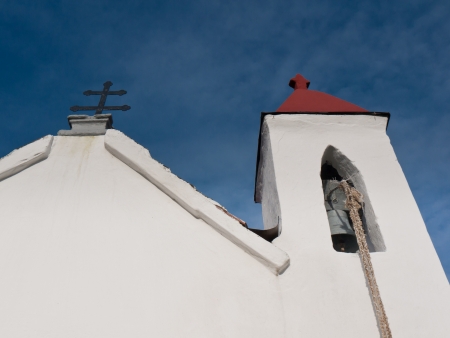 Front view of the church with cross and bell towerの写真素材
