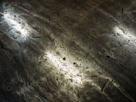 Heavily rough surface of the metal workbench plateの写真素材