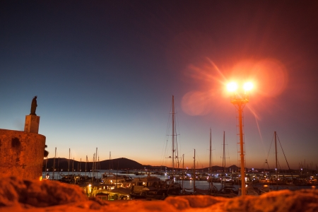Statue of a saint standing abovethe Italian portの写真素材