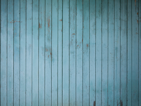 Weathered turquoise colored wooden boards as a backgroundの写真素材