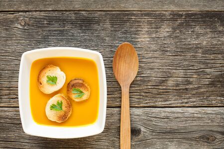 Hokkaido pumpkin soup with seeds. Top view of delicious autumn foodの写真素材