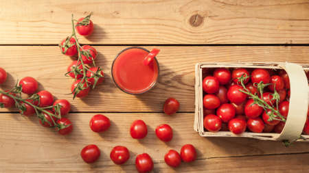 Ripe red tomatoes close up. Fresh vegetables preparation for healthy food and drinkの写真素材