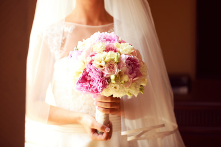 Bride holding a beautiful peonies bouquetの写真素材
