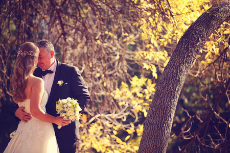 Bride and groom on a autumn dayの写真素材