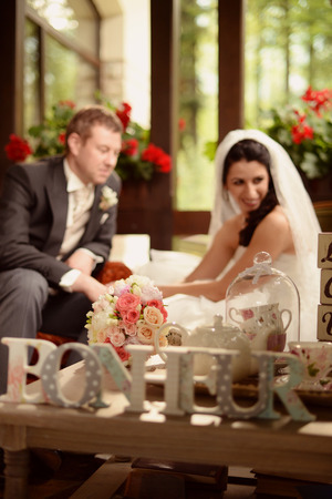 Bride and groom in a beautifully decorated roomの写真素材
