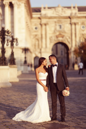 Vertical photograph of a bride and groom looking at each otherの写真素材