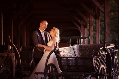 Bride and groom near carriageの写真素材