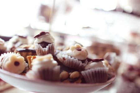 Delicious mix of sweets on tableの写真素材