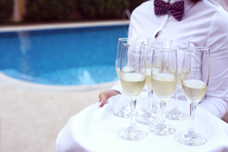 Waiter with glasses of champagneの写真素材