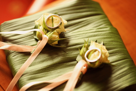 Wedding ring on rosesの写真素材