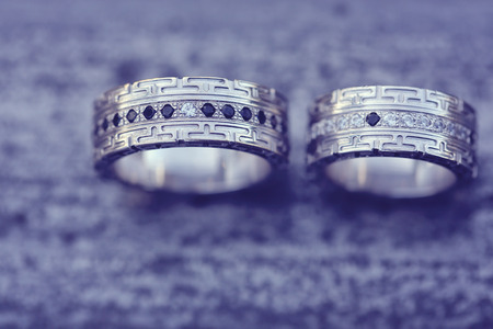 Beautiful wedding rings on woodの写真素材