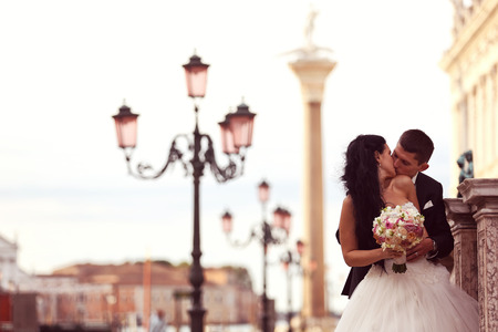 Bride and groom kissingの写真素材