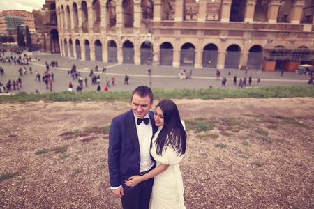 Bride and groom near Colosseum in Romeの写真素材