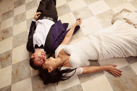 Bride and groom on pavementの写真素材