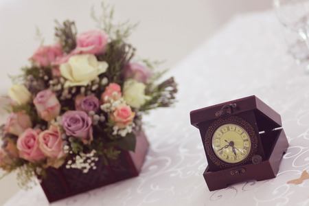 Old clock with bouquetの写真素材