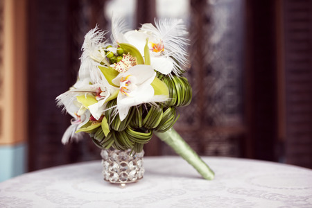 Elegant lily bouquet on tableの写真素材