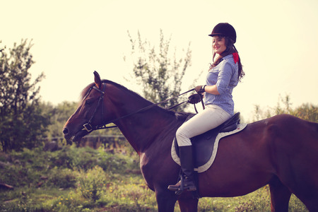 Beautiful woman with her horseの写真素材