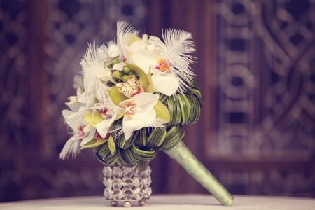 Elegant lily bouquet on tableの写真素材