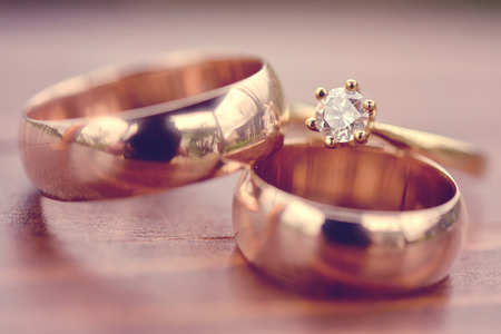 Beautiful golden engagement and wedding ringsの写真素材