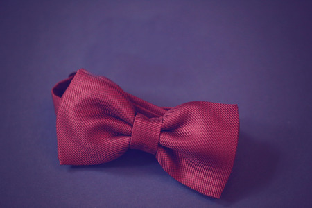 Red bowtie on blue background