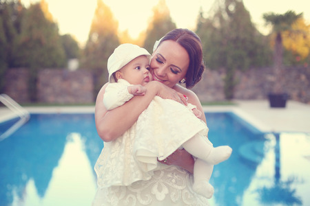Mother holding her beautiful baby