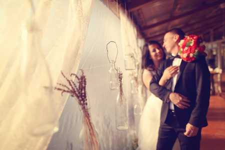 Bride and groom embracingの写真素材