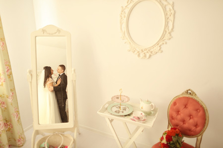 Bride and groom in a beautiful houseの写真素材