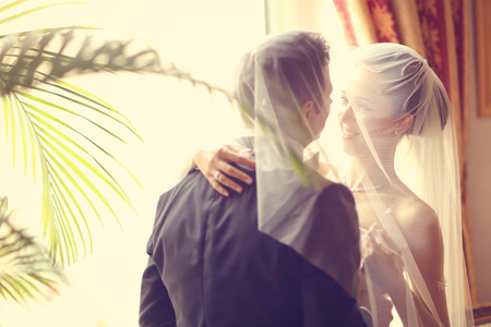 Bride and groom in the hotelの写真素材