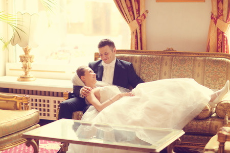 Bride and groom on sofaの写真素材