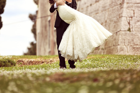 Bride and groom embracingの写真素材