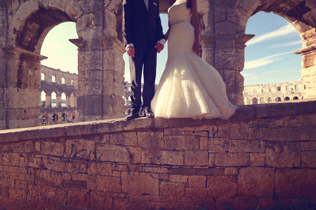 Bride and groom at Colosseum, Romeの写真素材
